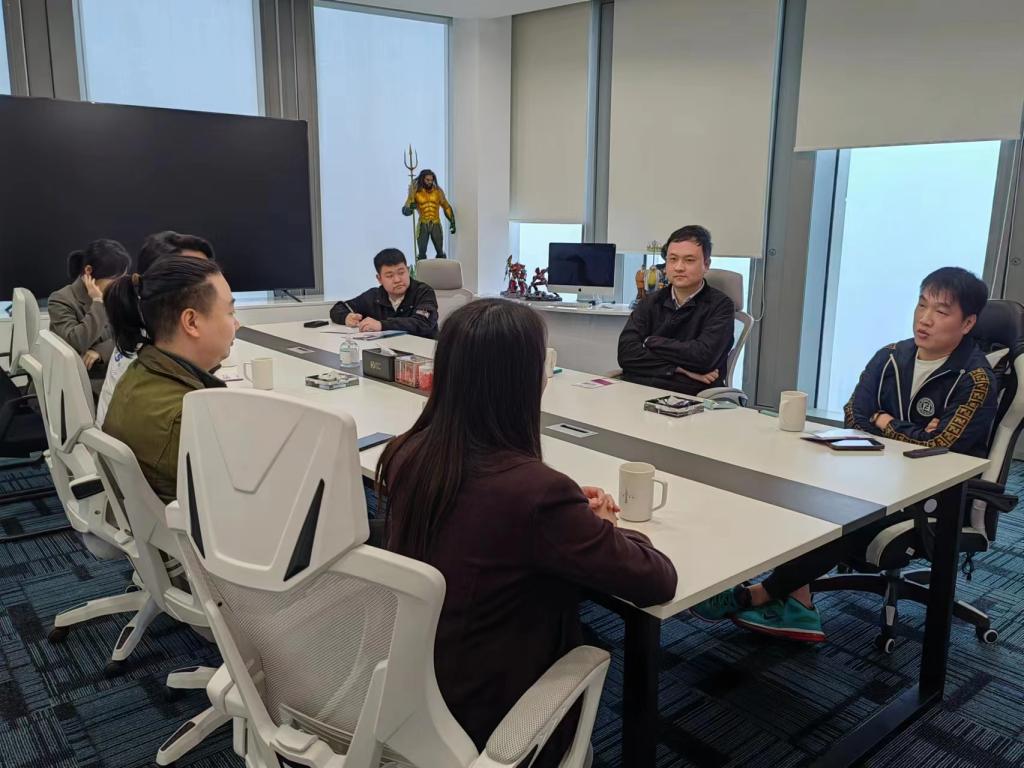 图为文传一行到昇格传媒座谈